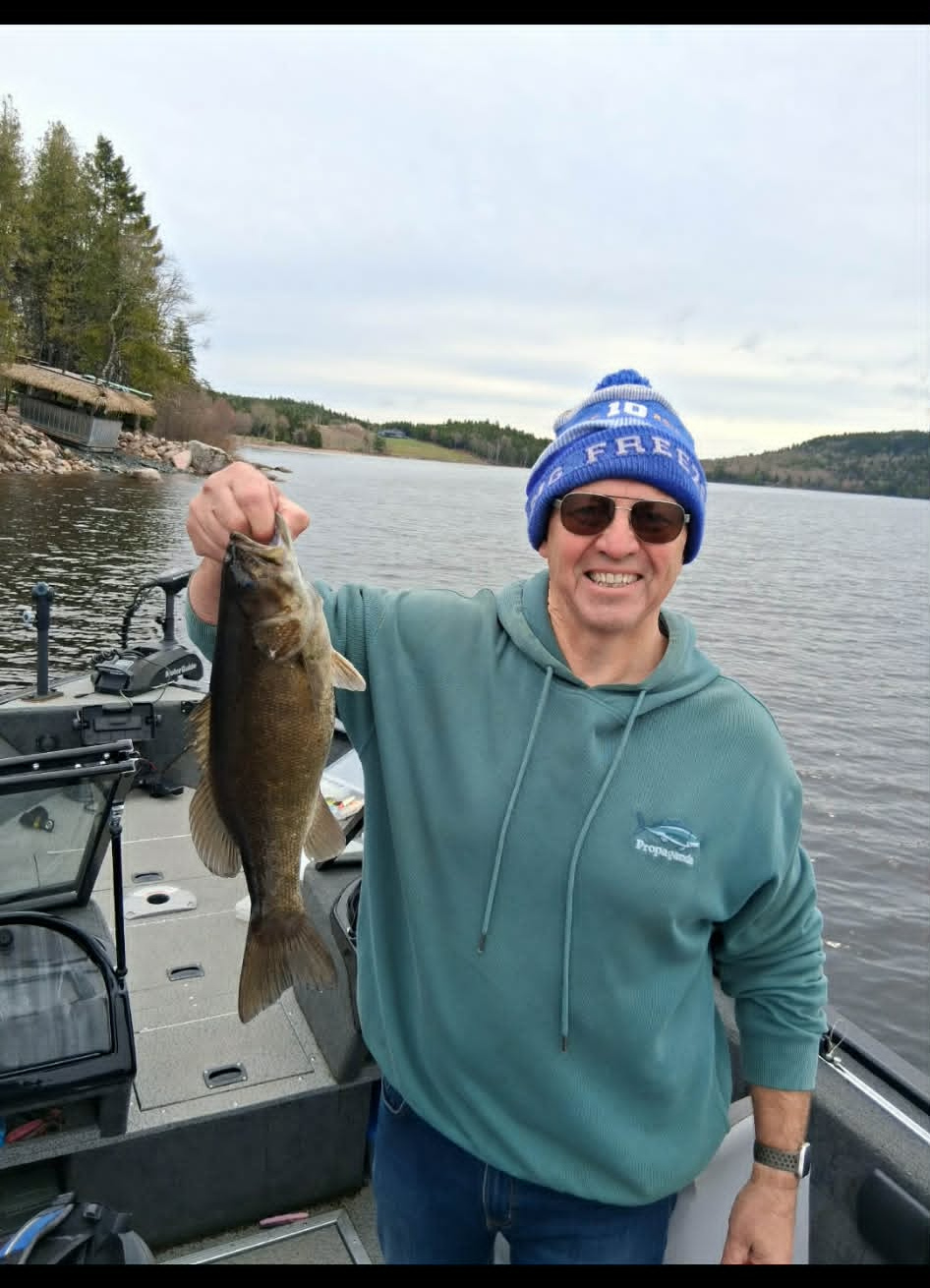 Angler holding a smallmouth bass on a Charlotte County lake