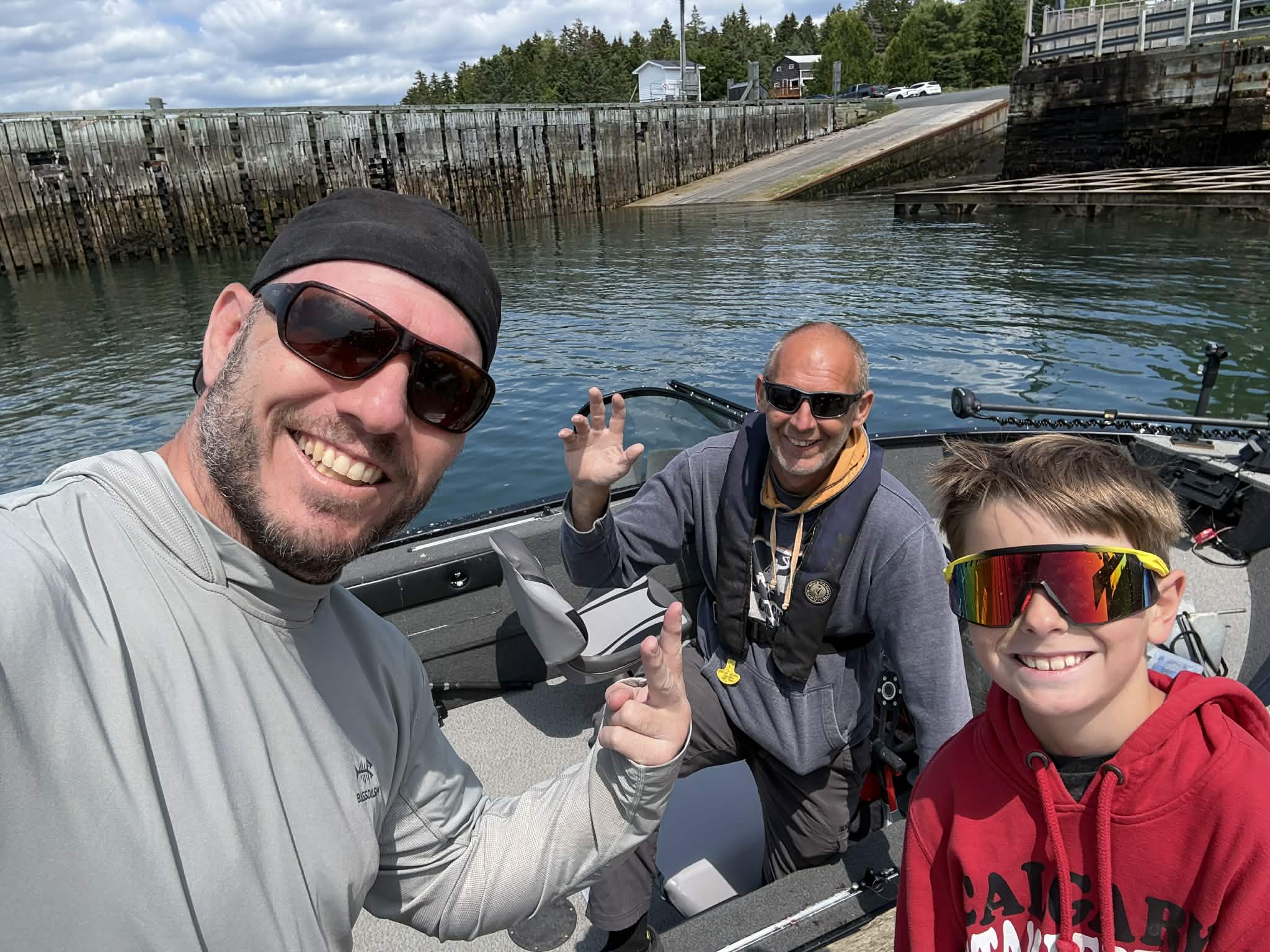 Group photo on a saltwater fishing trip at the ferry landing dock